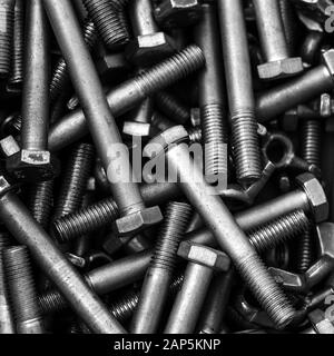 Bolts are steel. Elongated cylindrical products for fastening various structures and use in mechanical engineering, automotive industry Stock Photo