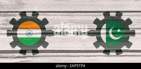 Web Banner, Header Layout Template. Politic and economic relationship between India and Pakistan. National flags on cog wheels. Wood texture Stock Photo