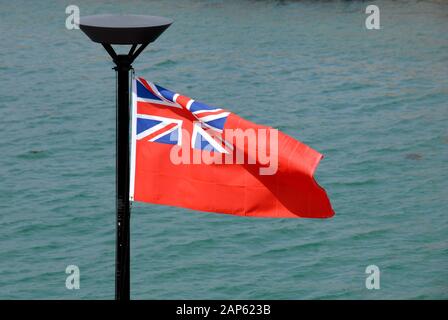 The Red Ensign or 'Red Duster', the flag of the British Merchant Navy, blowing in the breeze Stock Photo