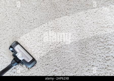 Cleaning carpet hoover. Carpet texture background. Stock Photo