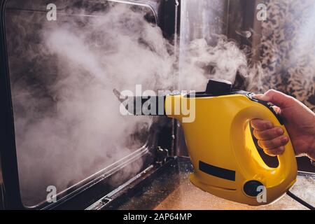 https://l450v.alamy.com/450v/2ap64mp/steam-cleaningovenhouse-cleaning-hand-close-up-2ap64mp.jpg