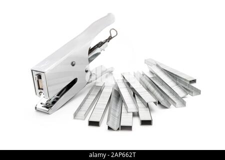Steel stapler and staples on white Stock Photo