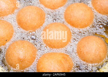 fritters in the process of cooking, traditional Colombian food. Stock Photo