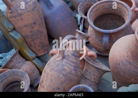 Pottery Craft Ceramic. clay dishes .Old Ceramic tableware is handmade on the counter . handmade clay ware.Pottery Craft Ceramic. Different pottery Stock Photo