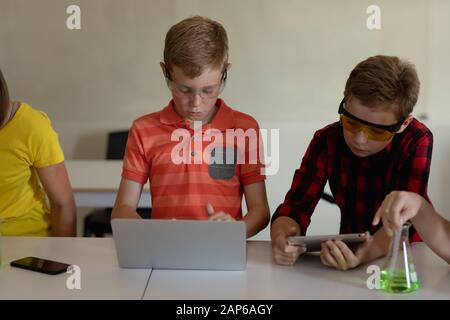 Group of elementary school kids in chemistry class Stock Photo