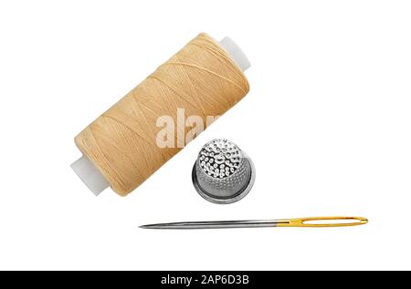 Premium Photo  A bobbin of thread with a needle and a thimble