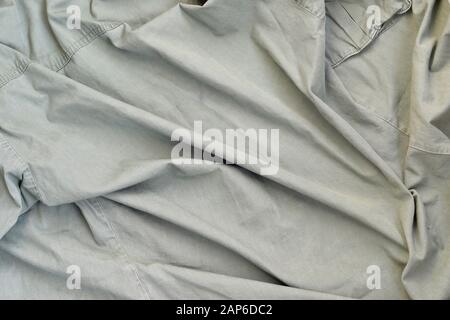 The texture of the fabric is olive-colored, which is similar to the uniform of American soldiers of the Second World War. Background image for militar Stock Photo