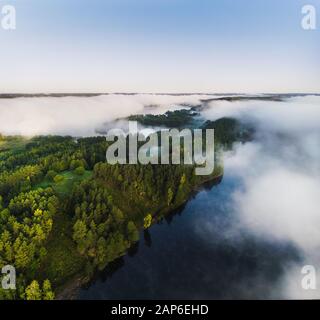 Lithuania landscape from the drone perspective in the misty morning Stock Photo