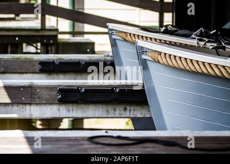 Wooden sailboats with thick ropes on the side Stock Photo