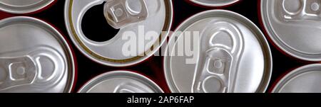 Many cans of soda soft drink, lemonade, cola, beer or energy drink containers. A lot of recycled cans made from aluminum and being prepared for re-pro Stock Photo