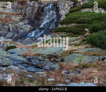 Vodopad Skok waterfall on Mlynicka dolina valley in Vysoke Tatry mountains in Slovakia during nice autumn morning Stock Photo