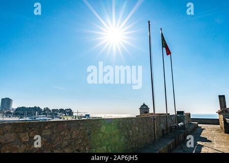 Porto Fort of Saint Francis Xavier Picturesque View with Waving Portuguese Flag on a Sunny Blue Sky Day Stock Photo