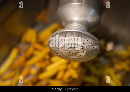 Metal Salt Shaker on French Fries Stock Photo