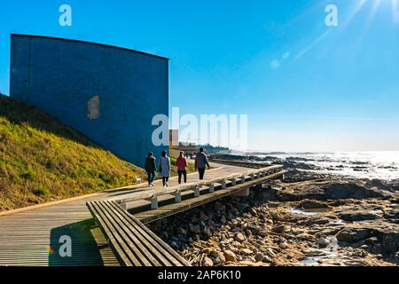 Porto Homem do Leme Beach Picturesque View with Walking People on a Sunny Blue Sky Day Stock Photo