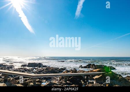 Porto Homem do Leme Beach Picturesque View with Sun Rays on a Sunny Blue Sky Day Stock Photo