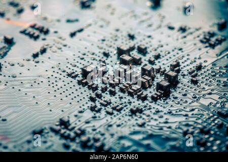 Close-up board with micro chips from an electrical appliance or computer. Concept of modern technology. Concept of electronics and microchips. SMD Stock Photo