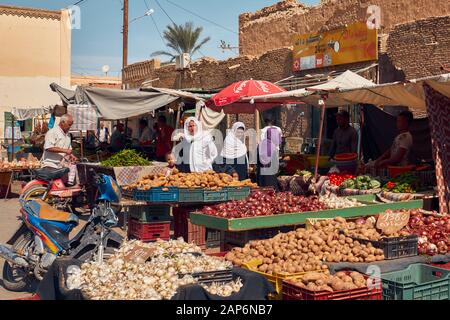 Tunisia, October 10/2019 traditional Tunisian market, women in traditional clothes shop for vegetables Stock Photo