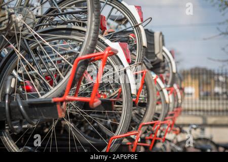 Bicycles on a row in Dutch bicycle parking lot Stock Photo