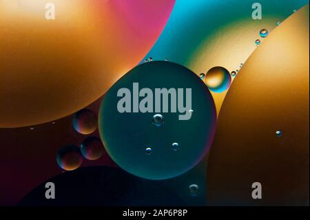 Colorful oil drops in water. Abstract background. Artistic macro photo. Stock Photo