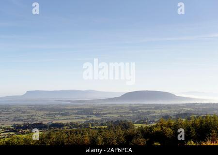 N.E. to Knocknarea Mt. beyond Ballysadare Bay, Sligo, Ireland. Early morning. Prehistoric stone cairn known as Queen Maeves Grave visible on summit Stock Photo