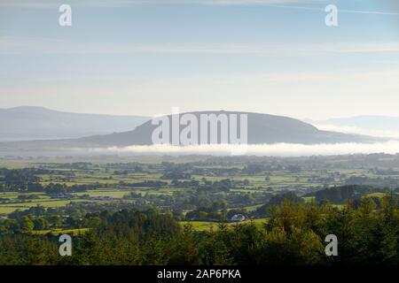 N.E. to Knocknarea Mt. beyond Ballysadare Bay, Sligo, Ireland. Early morning. Prehistoric stone cairn known as Queen Maeves Grave visible on summit Stock Photo