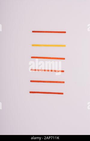 Sticks of various colors on awhite background Stock Photo