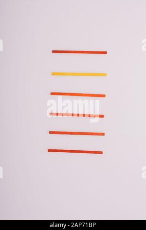 Sticks of various colors on awhite background Stock Photo