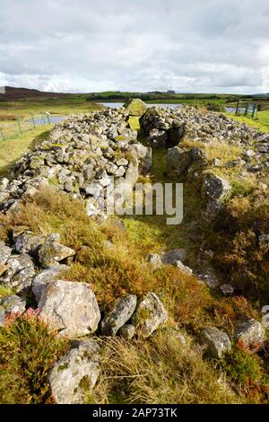 Creggandevesky Court Tomb Neolithic site, Co. Tyrone, N. Ireland. S.E. over 3 burial chambers to lintel portal out to the court. About 5700 years old Stock Photo