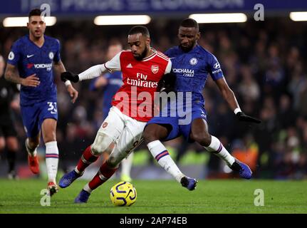 Arsenal's Alexandre Lacazette (left) and Chelsea's Antonio Rudiger battle for the ball during the Premier League match at Stamford Bridge, London. Stock Photo