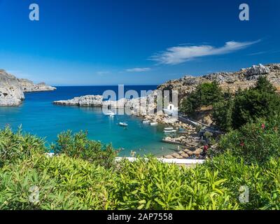 Overlooking the stunning St Pauls Bay Lindos Rhodes Island Greece Europe Stock Photo