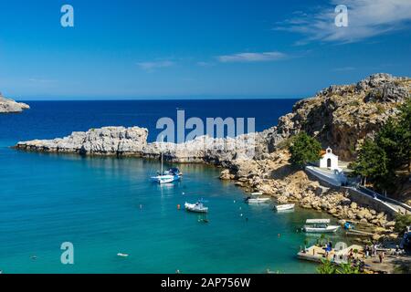 Overlooking the stunning St Pauls Bay Lindos Rhodes Island Greece Europe Stock Photo