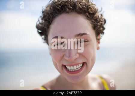 Portrait of young woman with short curly hair Stock Photo