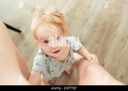 Little boy looking up to mom Stock Photo