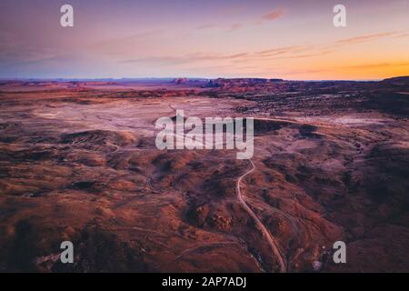 Aerial view of an unpaved road in a Arizona desert in the morning Stock Photo