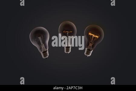 Incandescent electric bulbs that illuminate on a dark background Stock Photo