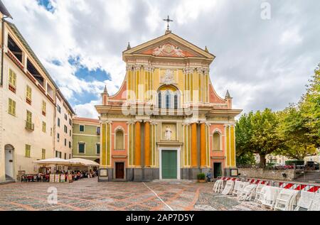 Front facade of he Sant Antonio Abate Church in a small piazza on an overcast day in Dolceacqua, Italy Stock Photo