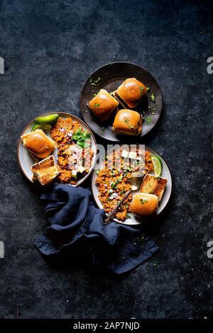 Indian Street Food - Spiced Mashed Vegetable Stew with buttered diner rolls. Stock Photo