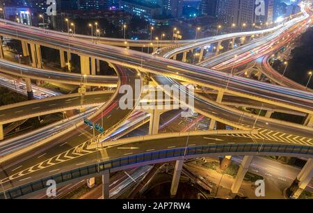 Shanghai city Busy intersection city traffic moving at night Stock Photo
