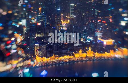 aerial view of Shanghai towers and tall buildings lighted up at night ...