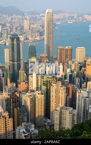 Hong Kong - March 11, 2019 - Tall skyscraper buildings in Hong Kong's busy Central District at sunset Stock Photo