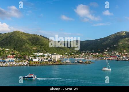 Road Town, British Virgin Islands - December 16, 2018: Coastline along a Road Town in Tortola, British Virgin Islands. The wooded hilltops above Road Stock Photo