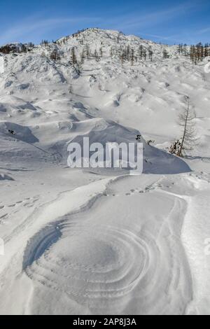 Circles made in snow, mountains Stock Photo