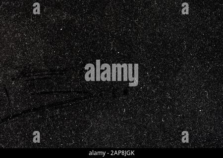 Macro image of the dust flecks on a black metal surface Stock Photo