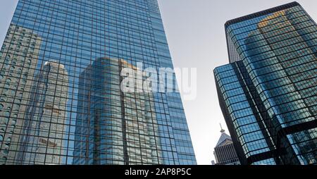 Reflections of Hong Kong in office building windows in central Hong Kong Stock Photo