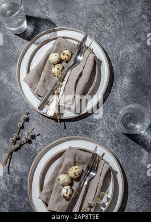Easter festive table setting with quail eggs. top view Stock Photo