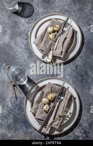 Easter festive table setting with quail eggs. top view Stock Photo
