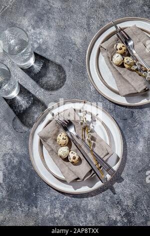 Easter festive table setting with quail eggs. top view Stock Photo