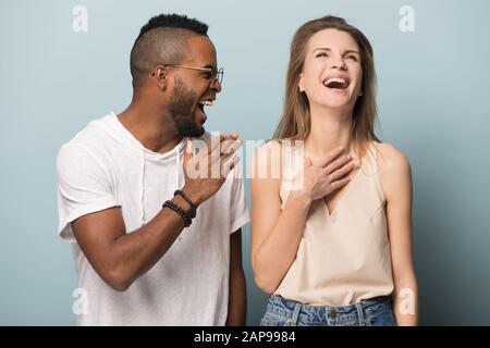 Happy multiracial people laugh isolated on studio background Stock Photo