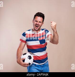 Fan is disappointed with soccer game Stock Photo