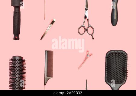 Flat lay composition with hairdresser set on pink background. Barber set with tools and equipment: scissors, combs and hairclips. Hairdresser and beau Stock Photo